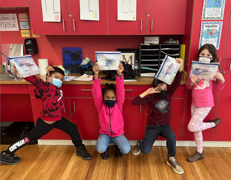 Milton Elementary second-graders (l-r) Suan Shirey, Brooke Lynn Cartwright, Angelo Berrocal and Charlotte Niblett are excited to receive their toothbrushing kits from Johnson Orthodontics. SUBMITTED PHOTOS